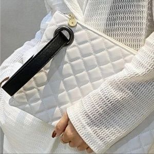 Classic oversized quilted clutch.